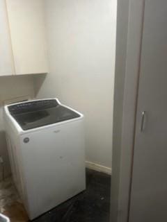 clothes washing area with laundry area and washer / clothes dryer