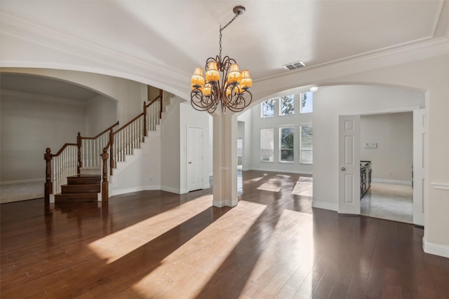 entryway with visible vents, stairway, hardwood / wood-style flooring, and baseboards