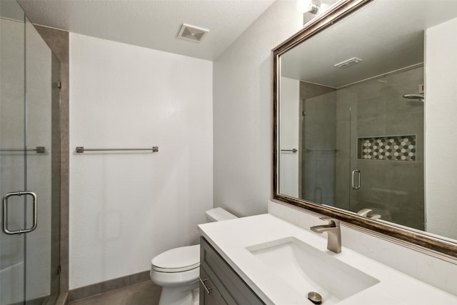 full bath with a stall shower, baseboards, visible vents, toilet, and vanity