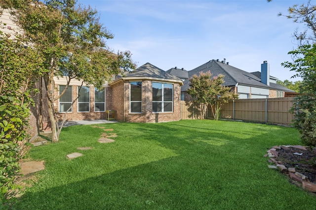 exterior space with a fenced backyard