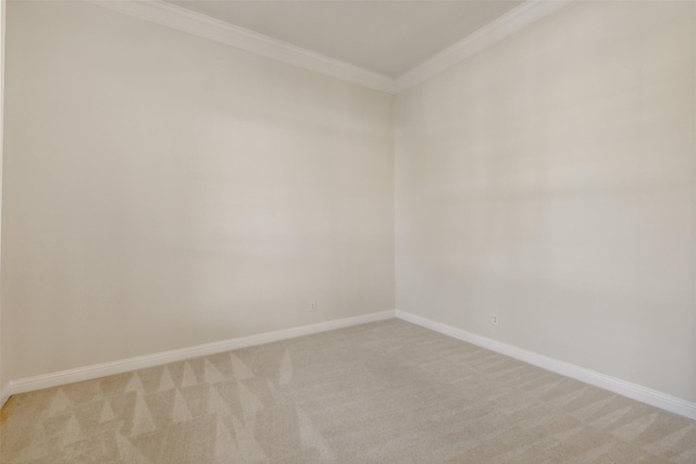 unfurnished room with light carpet, baseboards, and ornamental molding