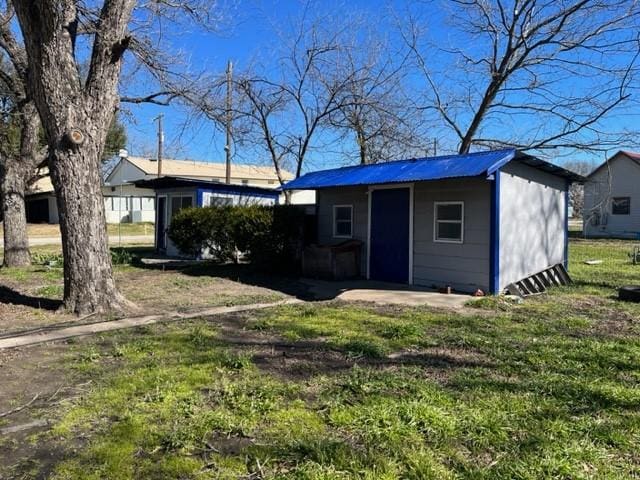 exterior space with an outbuilding