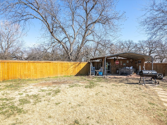 view of yard with fence and an outdoor structure