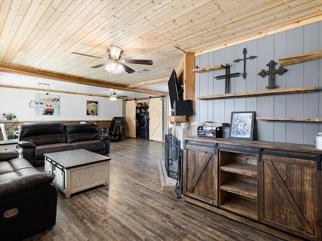 living area with a barn door, dark wood-type flooring, a ceiling fan, wood ceiling, and independent washer and dryer