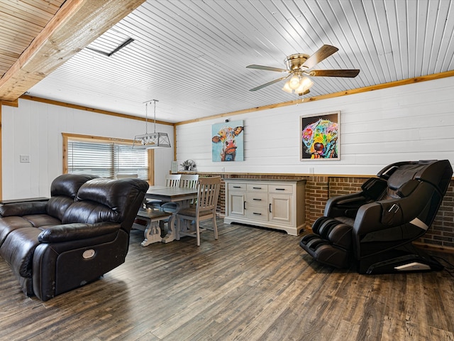 living room featuring a ceiling fan and dark wood-type flooring