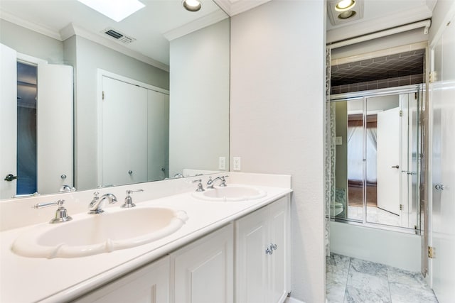 full bath featuring double vanity, a sink, visible vents, and crown molding