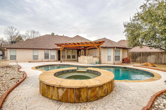 view of pool featuring a patio area, a pool with connected hot tub, a pergola, and fence