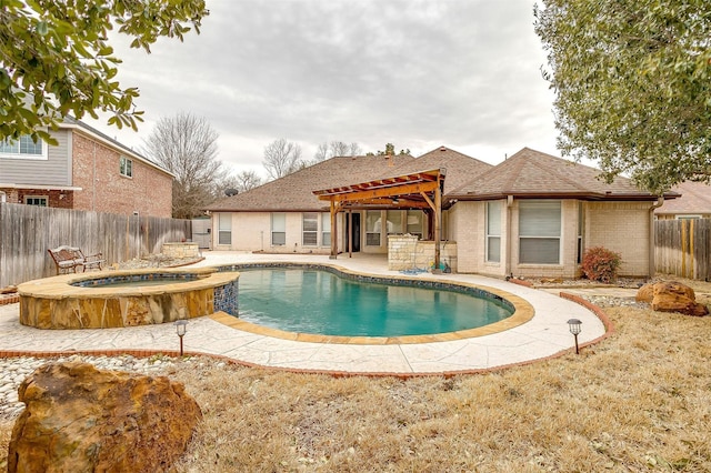 view of swimming pool featuring a patio area, a fenced backyard, a pergola, and a pool with connected hot tub