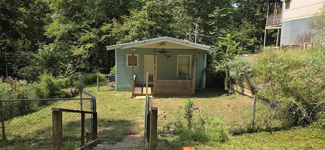 view of outbuilding featuring an outbuilding and fence