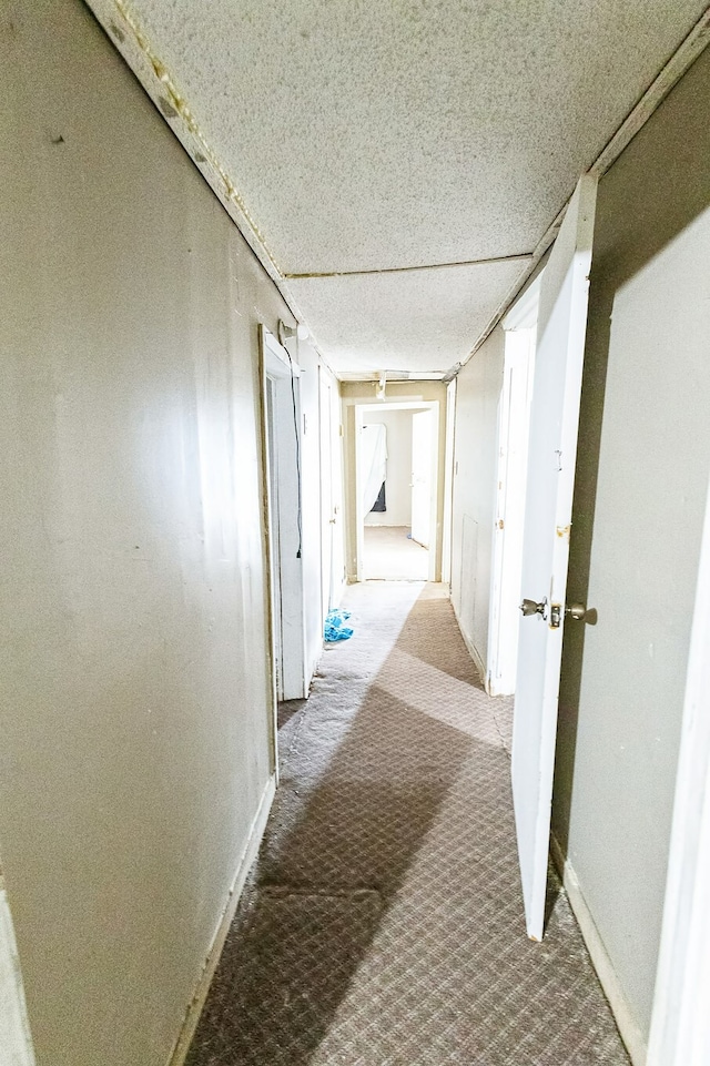 corridor featuring a textured ceiling