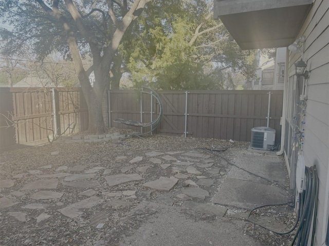 view of patio / terrace featuring a fenced backyard and central AC