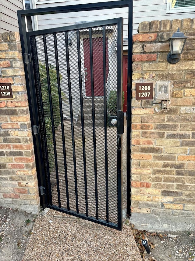 view of gate with fence