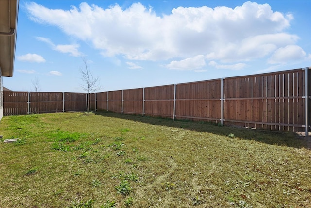 view of yard with a fenced backyard