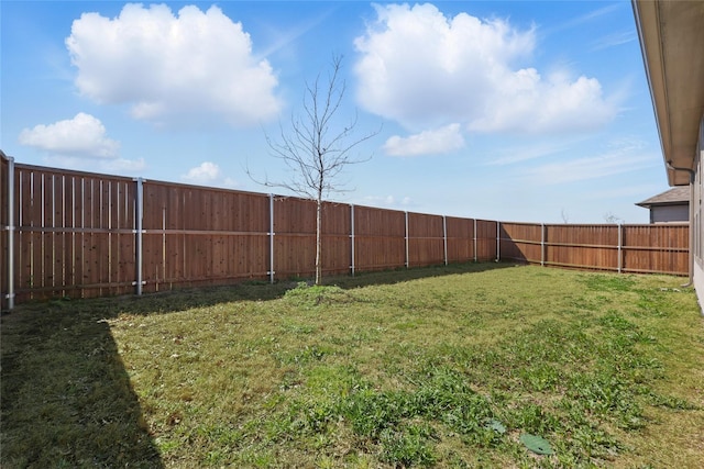 view of yard with a fenced backyard