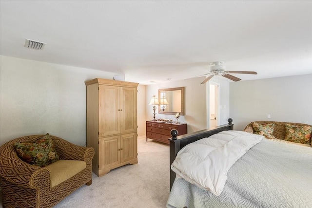 bedroom featuring light carpet, ceiling fan, and visible vents