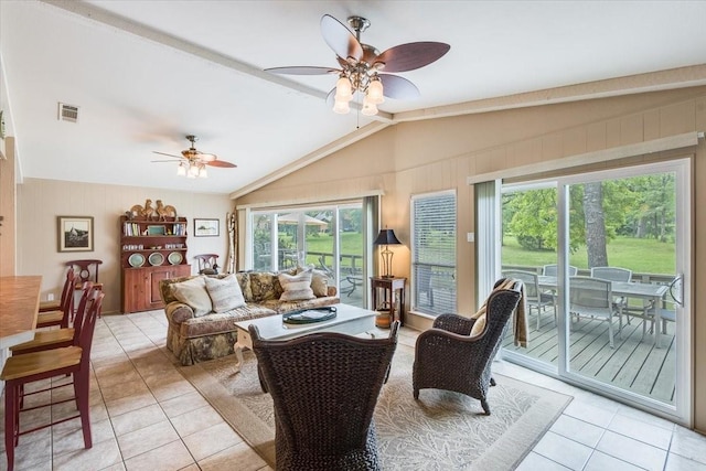 living room with vaulted ceiling with beams, ceiling fan, light tile patterned floors, and visible vents