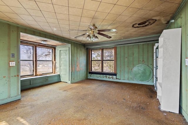 empty room with plenty of natural light and ceiling fan