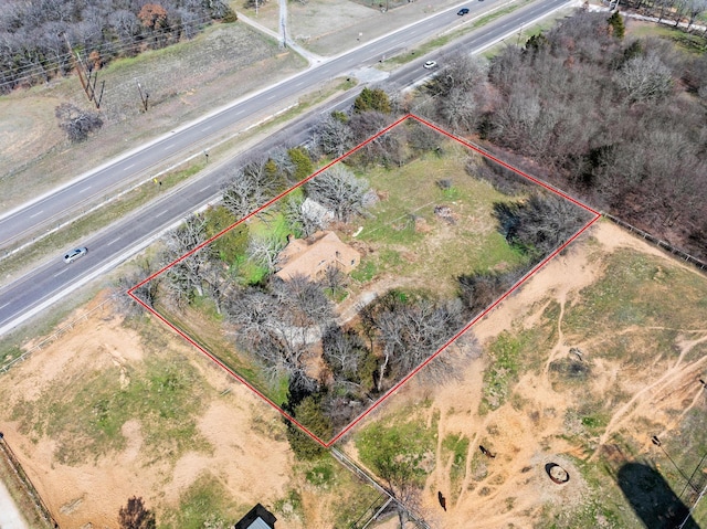 birds eye view of property with a rural view