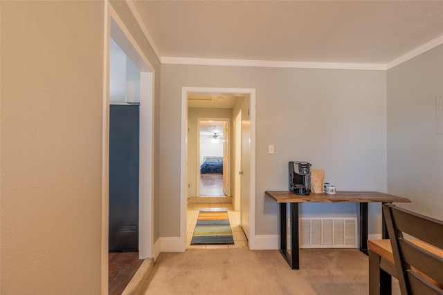 hall featuring ornamental molding, carpet floors, and baseboards