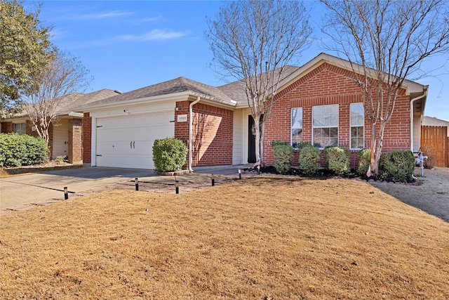 single story home featuring driveway, a garage, brick siding, roof with shingles, and a front yard