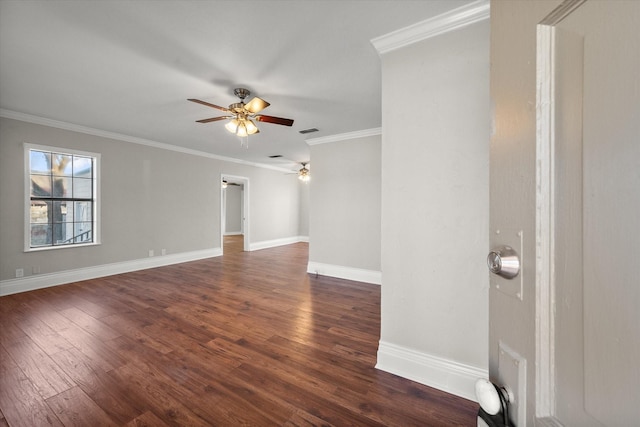 unfurnished room featuring dark wood-type flooring, a ceiling fan, visible vents, baseboards, and crown molding