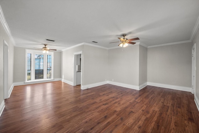 unfurnished room with baseboards, visible vents, dark wood finished floors, and ornamental molding