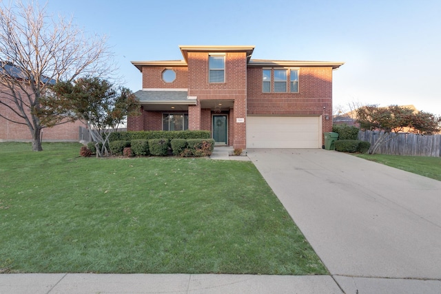 view of front of home with brick siding, concrete driveway, an attached garage, fence, and a front lawn