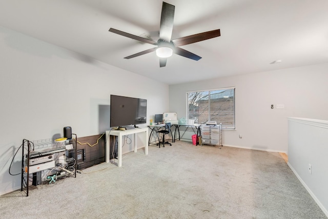 office area featuring carpet, baseboards, and a ceiling fan