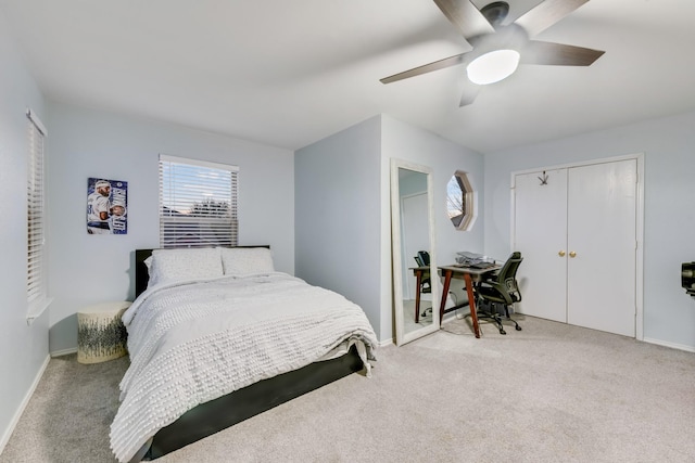 carpeted bedroom featuring ceiling fan, baseboards, and a closet