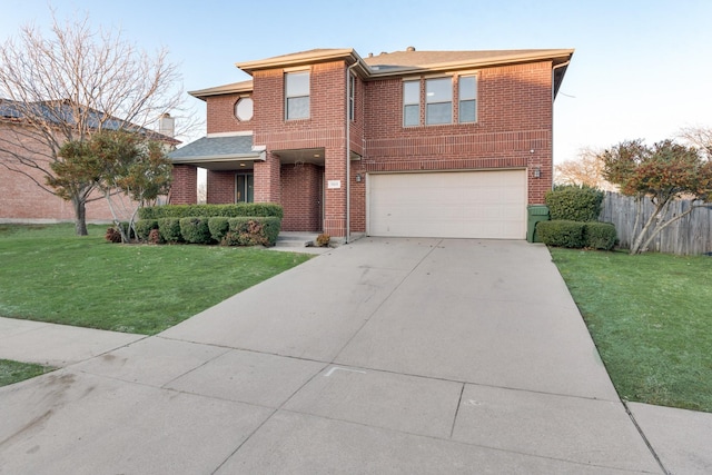 view of front of property with brick siding, an attached garage, fence, driveway, and a front lawn