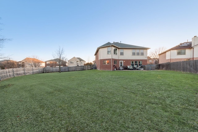 view of yard with a patio and a fenced backyard