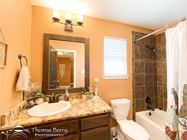 full bath featuring toilet, shower / bath combo with shower curtain, and vanity