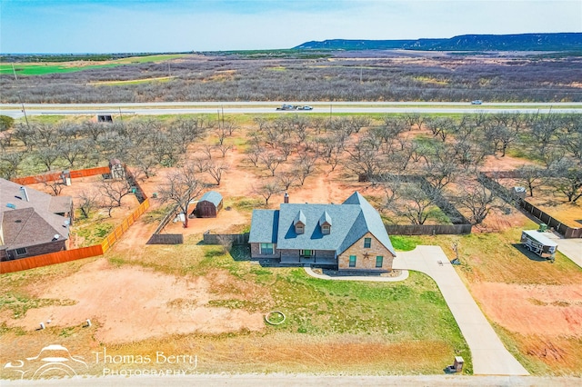 birds eye view of property featuring a mountain view