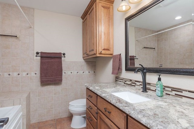 97 Elbert Rd, Van Alstyne, TX 75495 - full bathroom with a shower, toilet, tile patterned floors, vanity, and tile walls
