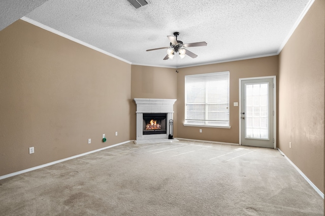 unfurnished living room with light carpet, a lit fireplace, and ornamental molding