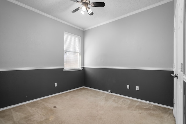 empty room with carpet floors, ornamental molding, a textured ceiling, and ceiling fan