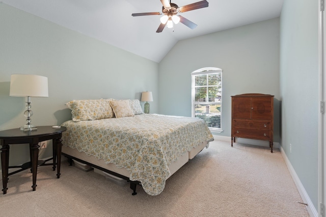 bedroom with carpet floors, vaulted ceiling, baseboards, and a ceiling fan