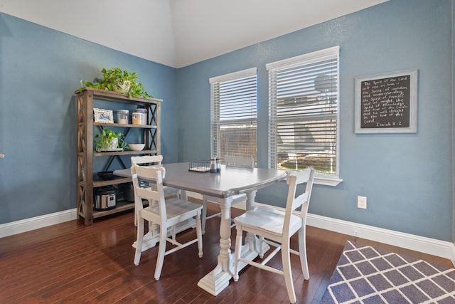 dining space with wood-type flooring, plenty of natural light, and baseboards