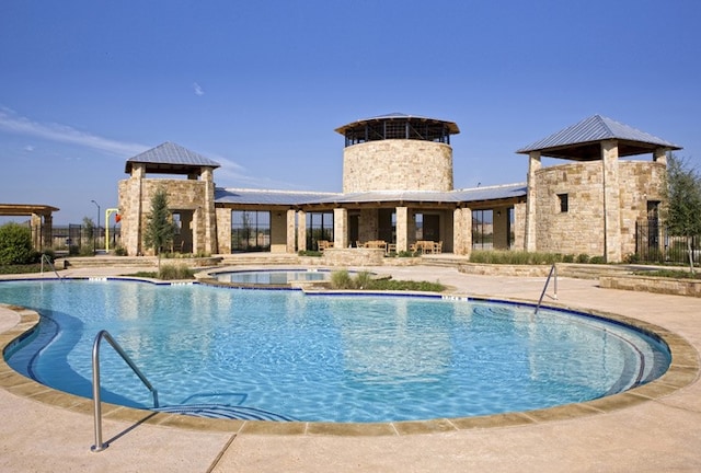 pool featuring a hot tub