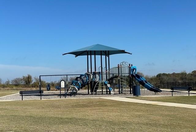 community playground featuring a yard