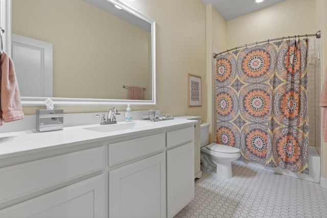 bathroom featuring shower / tub combo with curtain, vanity, and toilet