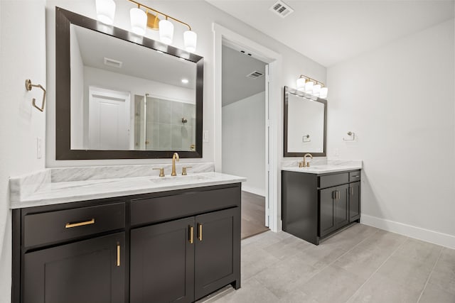 full bathroom with a shower stall, visible vents, and a sink