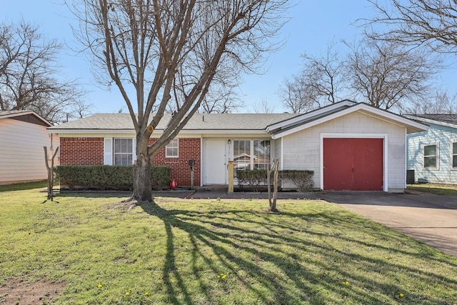 ranch-style home with a garage, driveway, brick siding, and a front yard