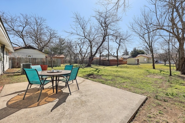 view of patio featuring an outdoor fire pit, central AC, and a fenced backyard