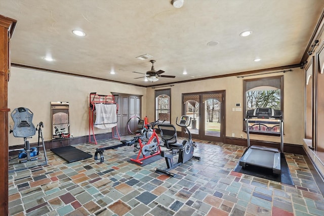 exercise room featuring crown molding, recessed lighting, baseboards, and stone tile floors