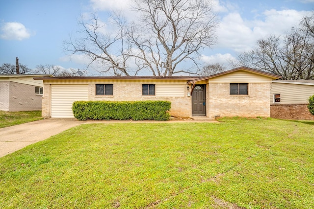 ranch-style house featuring a front yard, brick siding, and driveway