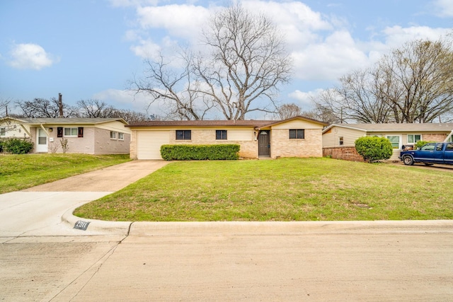 ranch-style house with driveway, a front lawn, and brick siding