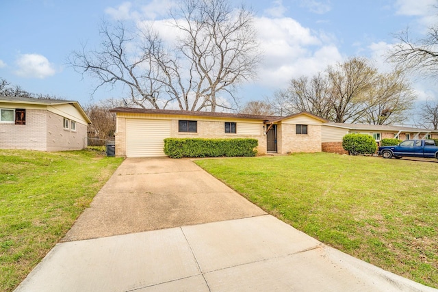 ranch-style house featuring concrete driveway, a front lawn, central AC unit, and brick siding