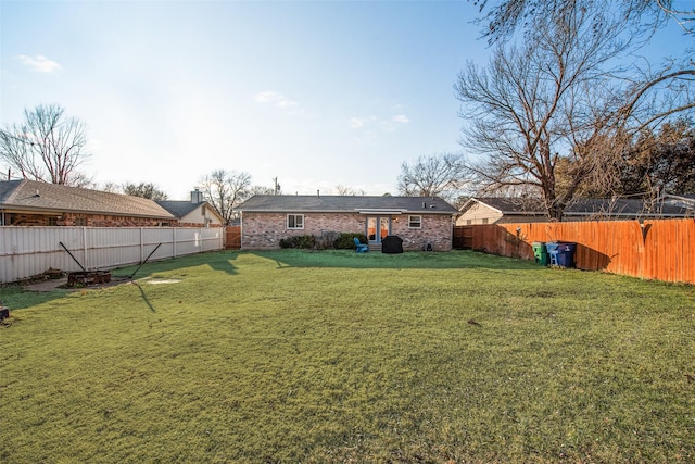 view of yard with a fenced backyard