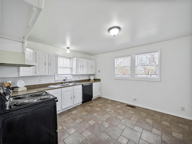 kitchen featuring baseboards, white cabinets, dark countertops, black appliances, and a sink